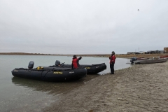 Nunavut, King William Island - Gjoa Haven - Scott McDougall (standing) waiting to take us back  to  Ship