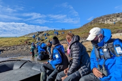 Greenland, Disko Bay- Zodiac landing, climb to small lake - Kathleen & John Gorman in Zodiac