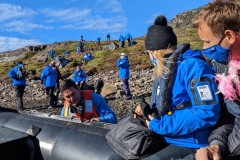 Greenland, Disko Bay - Zodiac landing - Jason helping - Anne & Kathleen in background
