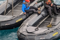 Nunavut Pond Inlet - Eva transferring to other Zodiac