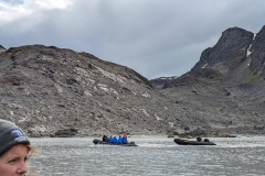 Greenland, Kangerlussuatsiaq - Callum & our Zodiac being towed back to ship