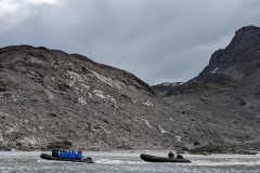 Greenland, Kangerlussuatsiaq - Callum & our Zodiac being towed back to ship