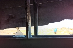 Nunavut, Somerset Island, Hudson Bay Co., Fort Ross - Manager’s House - Looking  out the  window with broken glass